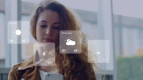 Woman tapping smartphone by windows, causing five-day weather cards to appear Stock Footage 334694256