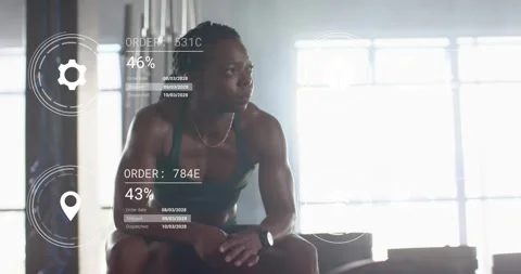 Woman tapping smartwatch and spawning holographic dispatch icons monitoring Vidéo 317115247