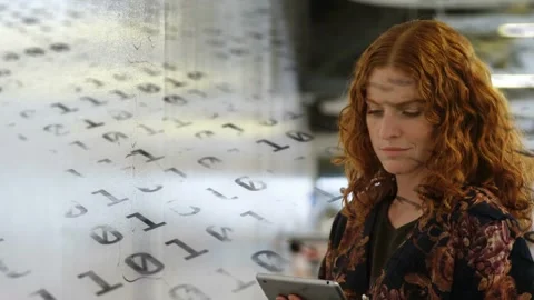 Woman tapping tablet activating shifting binary overlay, scanning data and Stock Footage 333351492
