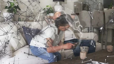 Woman tapping tablet and reaching man, causing globe node overlay moving across Video stock 333610064