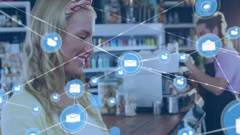 Woman tapping tablet, causing blue network icons linking and spreading over cafe Stock Footage 332566358