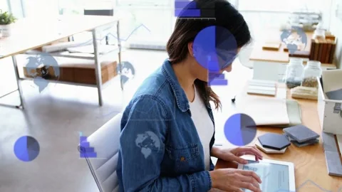 Woman tapping tablet at desk analyzing tech data, bringing charts obscuring view Stock Footage 335465952