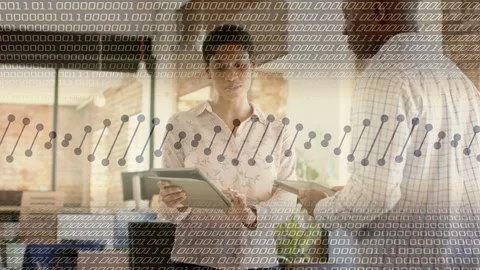 Woman tapping tablet, explaining tech data; man tilting device, comparing under Stock Footage 333301134