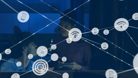 Woman tapping tablet generating tech network graph for setup while colleague Stock Footage 310643288
