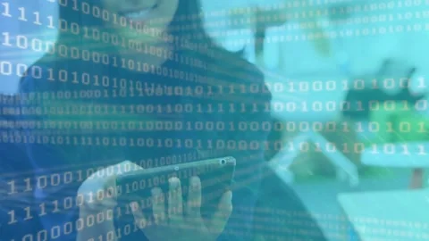 Woman tapping tablet initiating binary code overlay while guiding technology Stock Footage 330470040