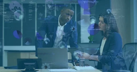 Woman tapping tablet, man leaning on desk, animated charts building while Stock Footage 334115699