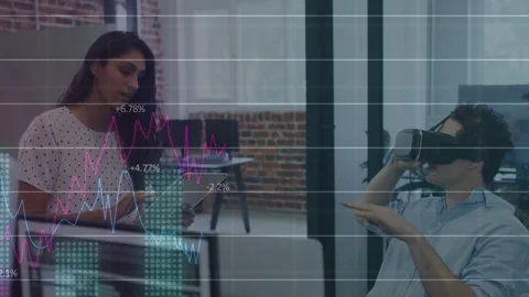 Woman tapping tablet, man using VR headset overlaying data grid and rising Stock Footage 332936900