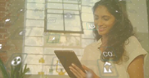 Woman tapping tablet screen and showing tech data with power and recycling icons Stock Footage 329772258