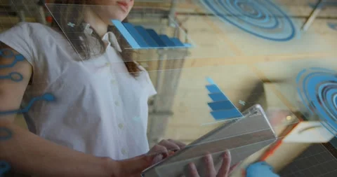 Woman tapping tablet screen in office, generating holographic circuits and Stock Footage 320287567