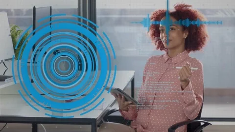 Woman tapping tablet with stylus, activating HUD waveform and code while showing Stock Footage 334373356