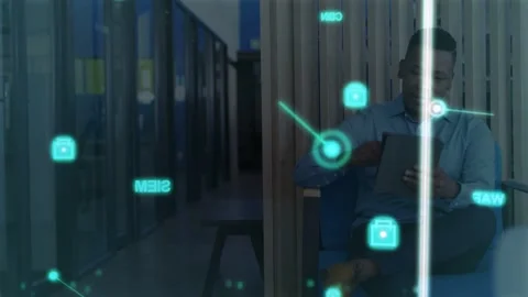 Woman tapping tablet in tech lounge, causing cyan holo icons clustering hexagons Stock Footage 333774936