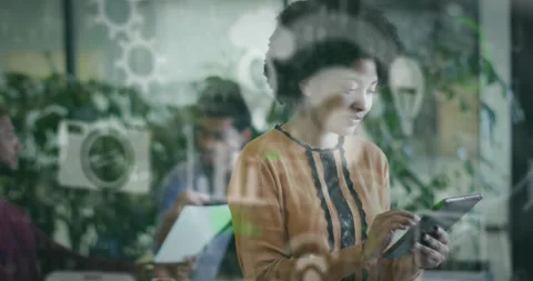 Woman tapping tablet in tech office, generating cloud wifi data icons on glass Stock Footage 321161413