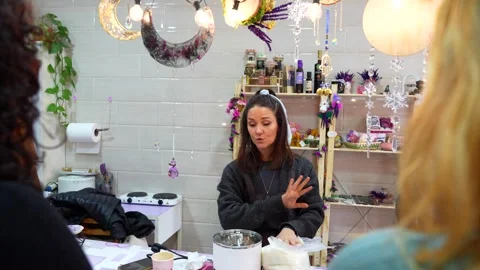 Woman teaching a candle making workshop class Stock Footage 334554986