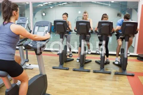 Woman teaching spinning class Stock Photos