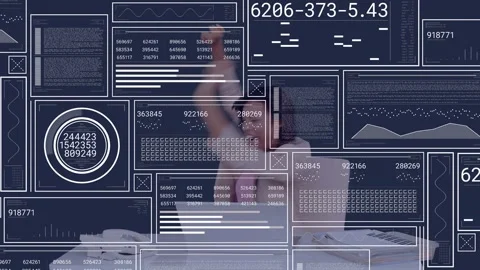 Woman at tech laptop typing analyzing data activating HUD tuning headset sliding Video stock 332469228