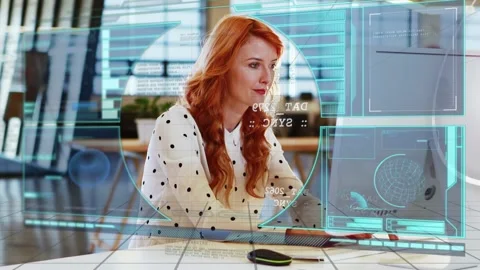 Woman in tech office moving mouse and adjusting cyan reticle and panels while Stock Footage 333106048