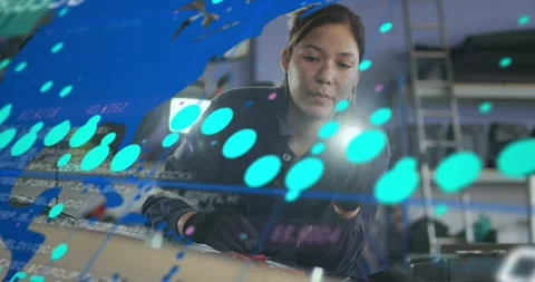 Woman tech scanning engine with torch, initiating blue map, teal dots and Video stock 332285159