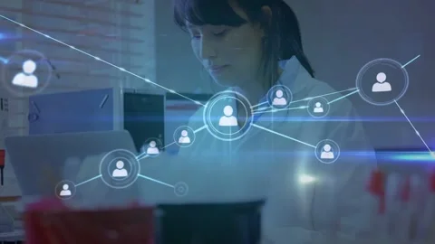 Woman tech standing at bench, PC showing network icon, nodes expanding Stock Footage 332821994