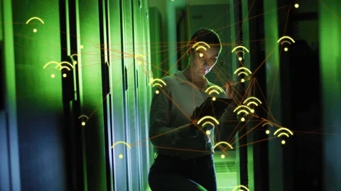 Woman tech tapping tablet in data center aisle, animated Wi?Fi icons mapping Stock Footage 331789849