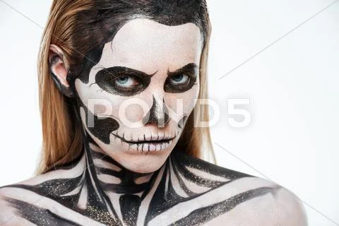 Woman with terrifying skeleton makeup Stock Photos