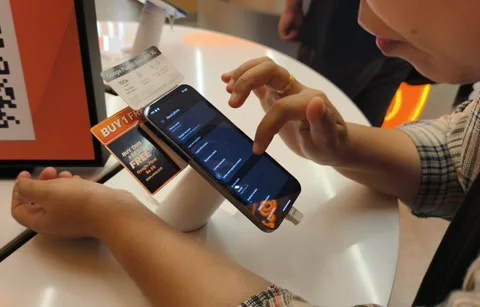 Woman Testing iPhone 17 Pro Max in Mobile Store. Stock Footage 321067062