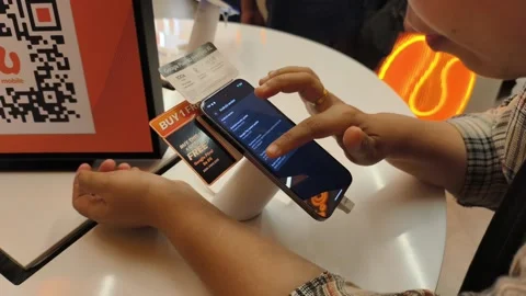 Woman Testing the Latest iPhone in Store. Ipoh,Malaysia – November 2025 Stock Footage 321066977