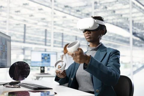 Woman testing microchip electronics prototypes using VR tech Stock Photos