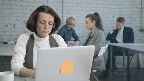 Woman testing online program for small business and making impor Stock Footage 110801699