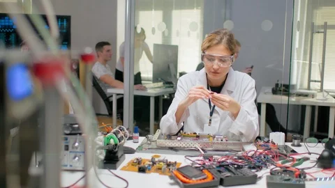 Woman testing processor before installing it in computer Stock Footage 97631973
