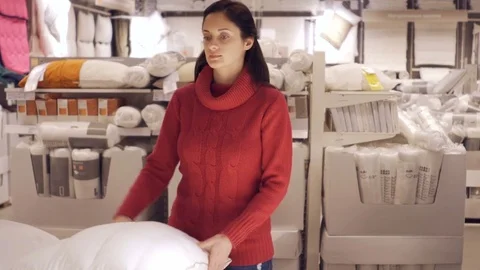 A Woman is testing the softness of the pillow Stock-Footage 72216665