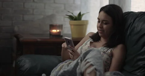 Woman Texting on Couch Video stock 133189772