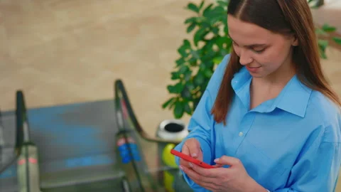 Woman Is Texting on Smartphone While Being on the Escalator. Shopaholic Girl Stock Footage 240412672