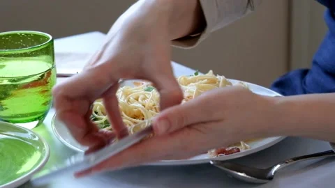 Woman Texting on Smartphone While having dinner, close up Stock Footage 88317217