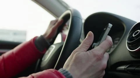 Woman Texting while Driving a Car Stock Footage 60388304
