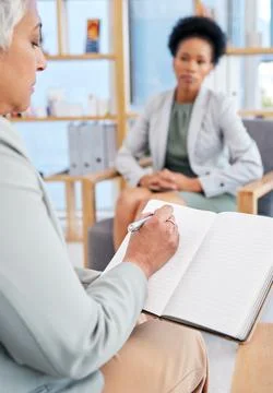 Woman in therapy and therapist writing, counseling and psychology evaluation Stock Photos