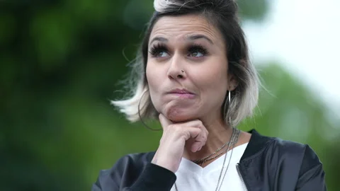 Woman thinking about problem finding a solution, eureka moment Stock Footage 165751709