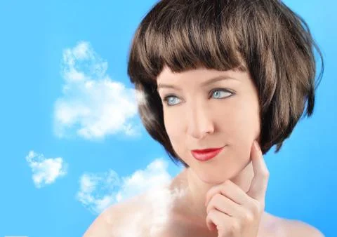 Woman thinking with clouds Stock Photos
