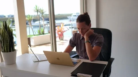 Woman thinking in front of computer Stock Footage 88151718