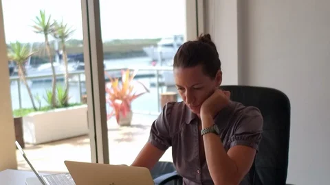 Woman is thinking at her desk Stock Footage 88463581