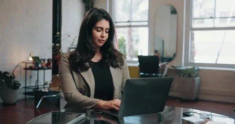 Woman, thinking or typing in small business with laptop, customer schedule or Stock Footage 321829353