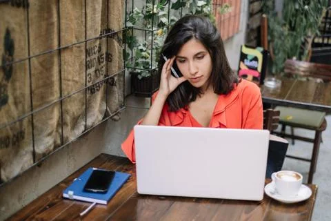 Woman thinking while looking at her laptop Stock Photos
