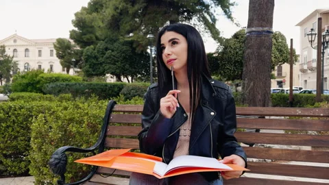 Woman Thinking While Studying At The Park Stock Footage 275297420
