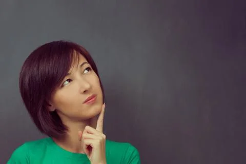 Woman thinks, copyspace Stock Photos