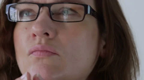 Woman thinks Stock Footage 47989181