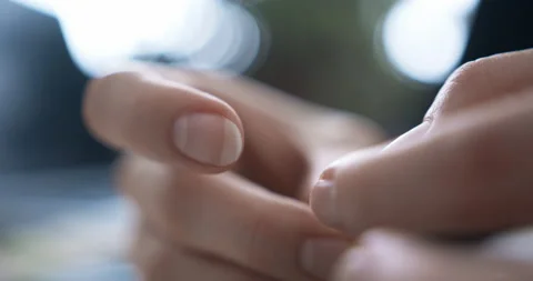 Woman is threading a thread through the eye of a needle Stock Footage 146359725