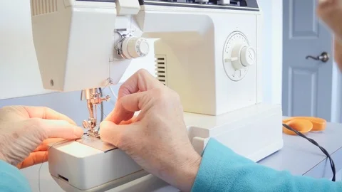 Woman Threads a Sewing Machine in 4k Stock Footage 88892803