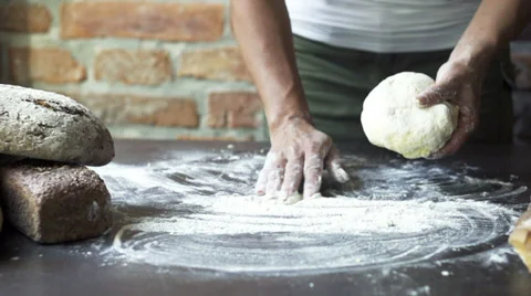 Woman throwing dough on the table, slow motion at 60 fps Stock Footage 31708573