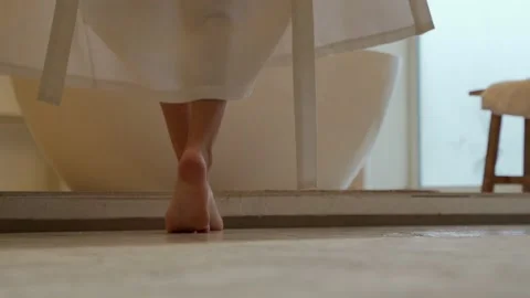 Woman throws off her robe while taking a... | Stock Video | Pond5