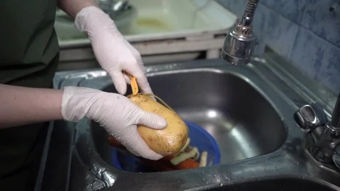 Woman throws potatoes Stock Footage 123337652