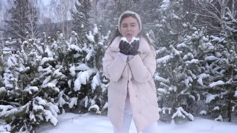 Woman throws snow Stock Footage 166227097
